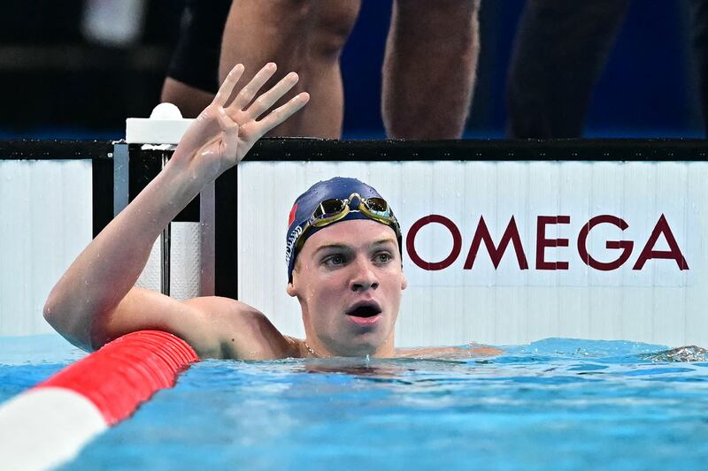France's Leon Marchand gestures after winning his fourth gold medal of the Olympic Games in the men's 200m individual medley. Photograph: Manan Vatsyayana/AFP via Getty Images