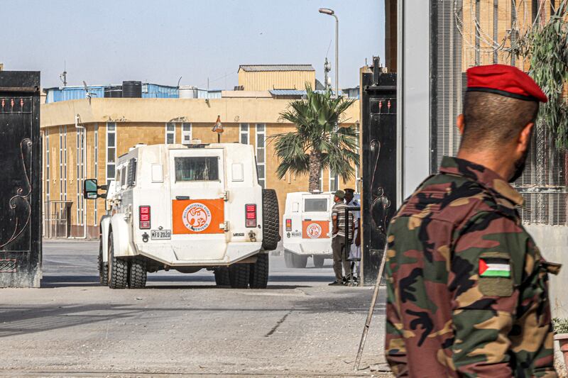 A Palestinian policeman loyal to Hamas looks on as a vehicle of the Multinational Force and Observers crosses towards the Egyptian side of the Rafah border crossing in the southern Gaza Strip in June.  Photograph: Said Khatib/AFP via Getty Images