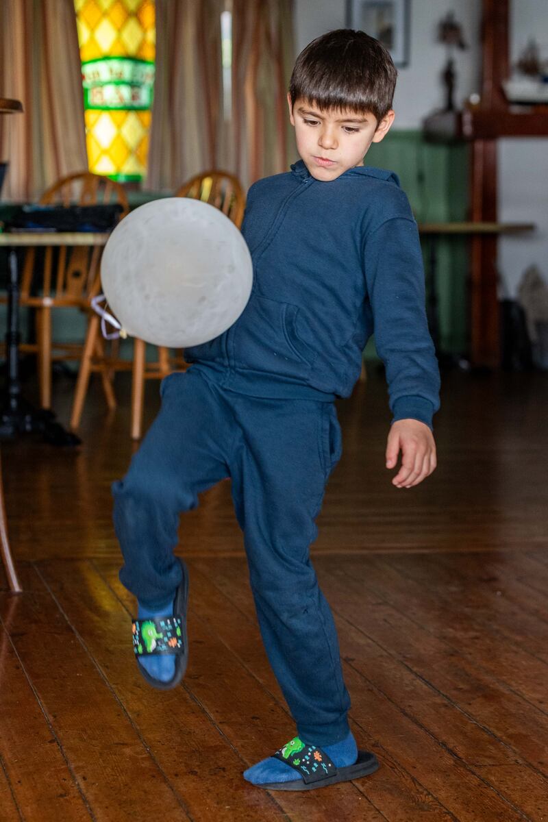 Seven-year-old Ukrainian refugee Samir Seitmemetov playing at the Sherkin House Hotel. Photograph: Andy Gibson