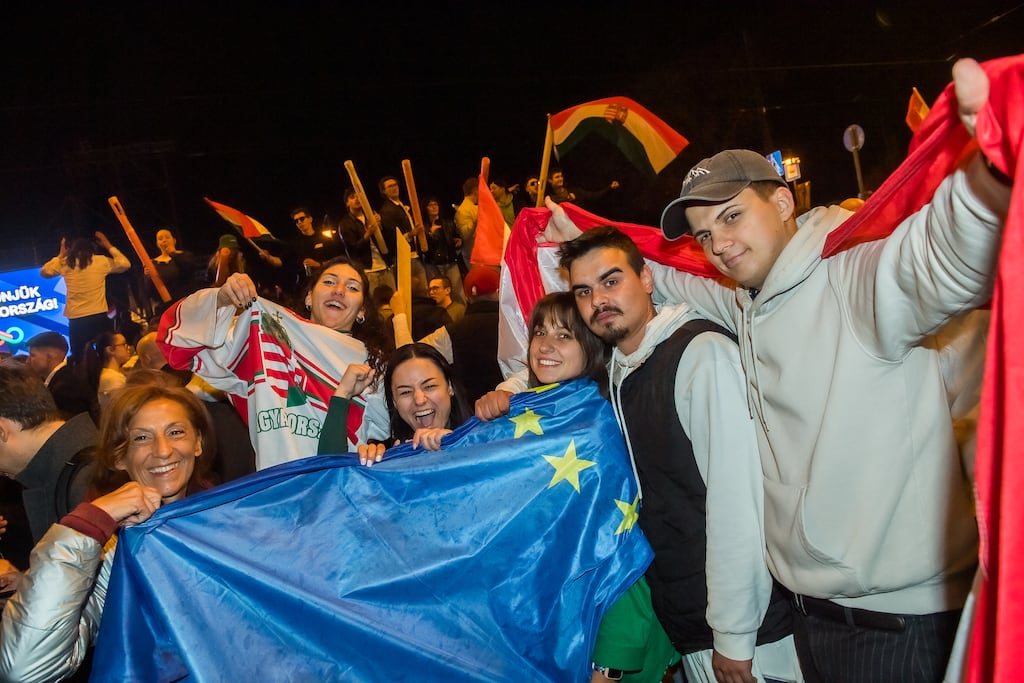 People celebrate in the streets after Hungarian prime minister Viktor Orbán conceded defeat to Péter Magyar, leader of the pro-European conservative Tisza party, in Budapest. Photograph: Ferenc Isza/AFP/Getty Images