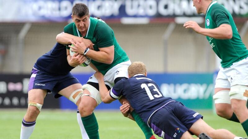 Ireland’s Matthew Dalton is tackled during his side’s defeat to Scotland under-20s. Photograph: Pascal Rodriguez/Inpho