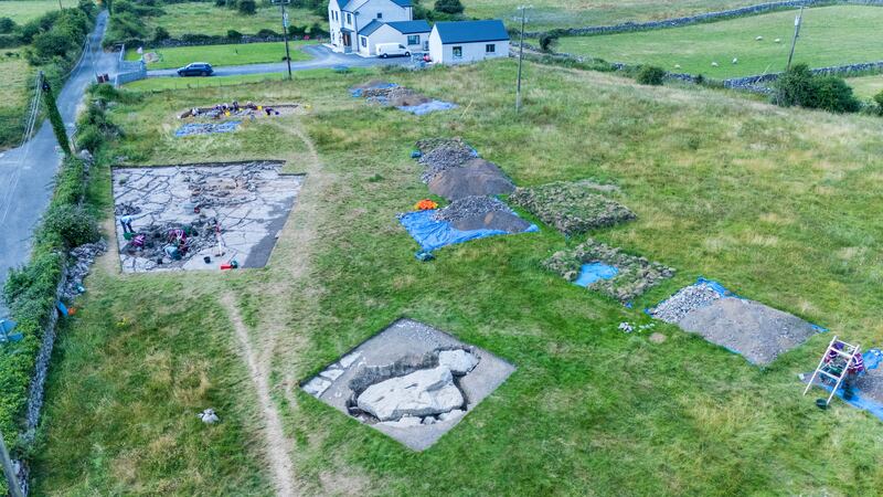 The excavation site at Prospecthill, Co Galway, with the portal tomb capstone in the foreground and the outline of the court tomb behind. Photograph: Andrew Downes