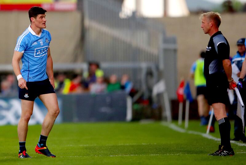Diarmuid Connolly speaks to linesman Ciaran Branagan. Photograph: James Crombie/Inpho