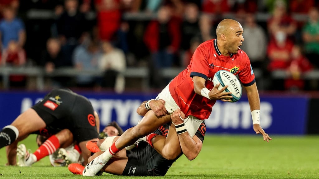 Simon Zebo offloads during Munster’s United Rugby Championship opener against the Cell C Sharks at Thomond Park on Saturday night. Photograph: Dan Sheridan/Inpho