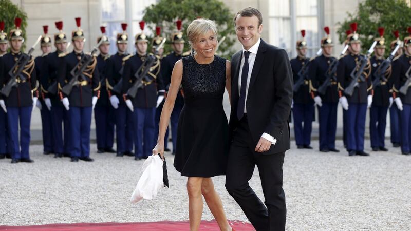Brigitte Trogneux and Emmanuel Macron (then minister for the economy) arrive at the Élysée Palace in Paris to attend a dinner in honour of Spain’s King Felipe VI and Queen Letizia in June 2015. Photograph: Philippe Wojazer/Reuters