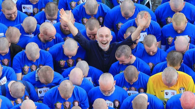 Ray D’Arcy with 178 people outside the Mansion House in Dublin as The Ray D’Arcy Show set a new world record of 179 for the Most Heads Shaved Simultaneously for Today FM’s Shave or Dye 2014. Photograph: Marc O’Sullivan/Guiness World Records