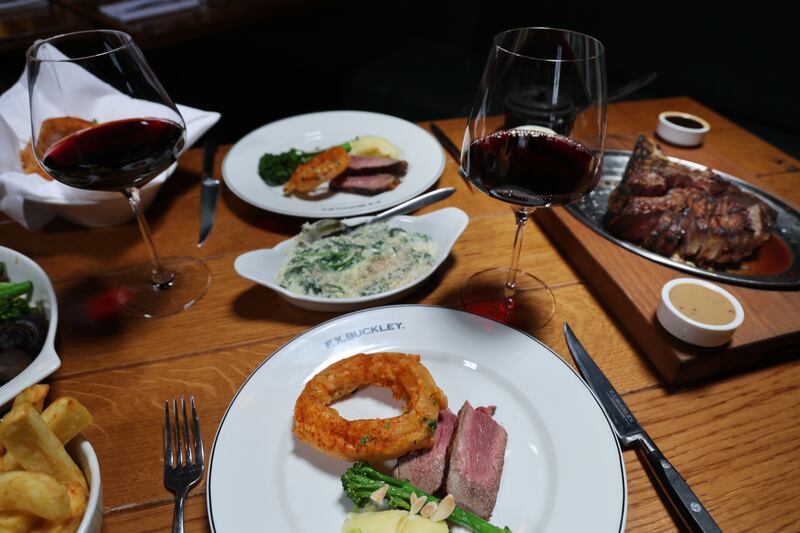 32oz Porterhouse sharing steak with chips, onion rings, mashed potato, creamed spinach, broccoli, caramelised onions and mushrooms. Photograph: Bryan O’Brien