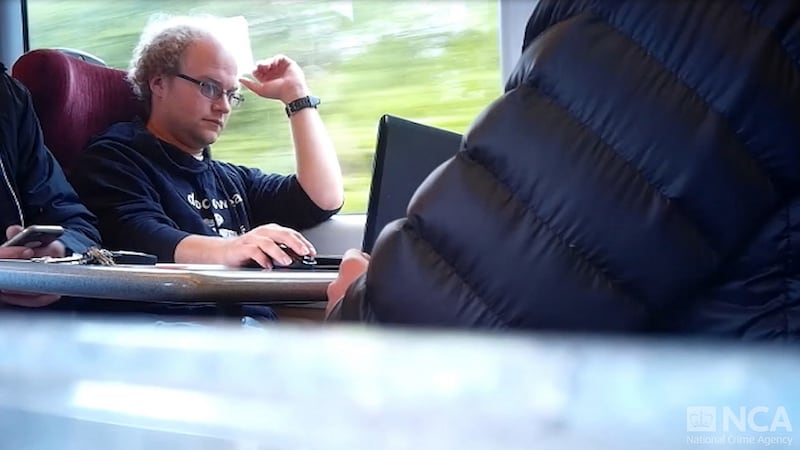 A still taken from surveillance footage of Matthew Falder on a train. Photograph:    National Crime Agency/PA Wire
