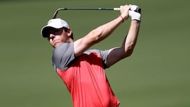 Rory McIlroy roars into contention as hot putter helps serve up a 65