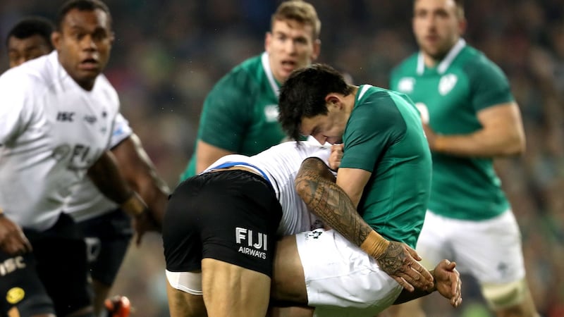Ireland’s Joey Carbery is tackled by Jale Vatubua of Fiji. Photograph: Bryan Keane/Inpho