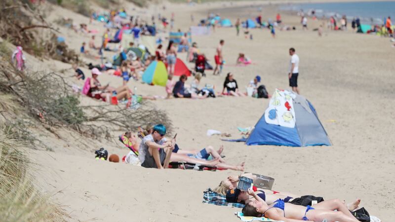 Sun bathers on the beach in Brittas Bay Co Wicklow. Photograph:  credit should read: Niall Carson/PA Wire
