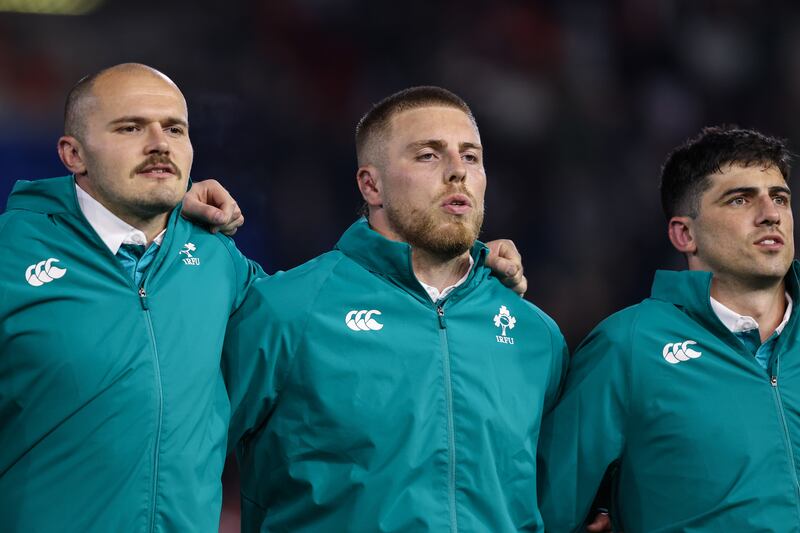 Ireland's Jacob Stockdale, Sean Jansen and Jimmy O’Brien during the national anthem. Photograph: Ben Brady/Inpho