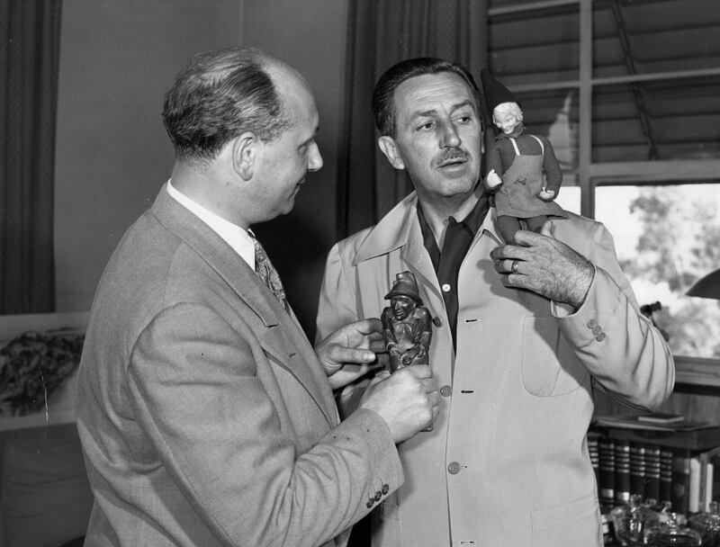 Louis Elliman and Walt Disney discussing Darby O'Gill and the Little People. Courtesy of Wendy Elliman