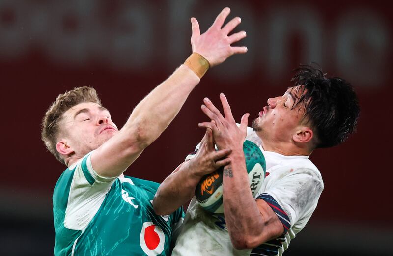 Ireland’s Garry Ringrose and Marcus Smith of England compete for the ball. Photograph: Inpho/Billy Stickland