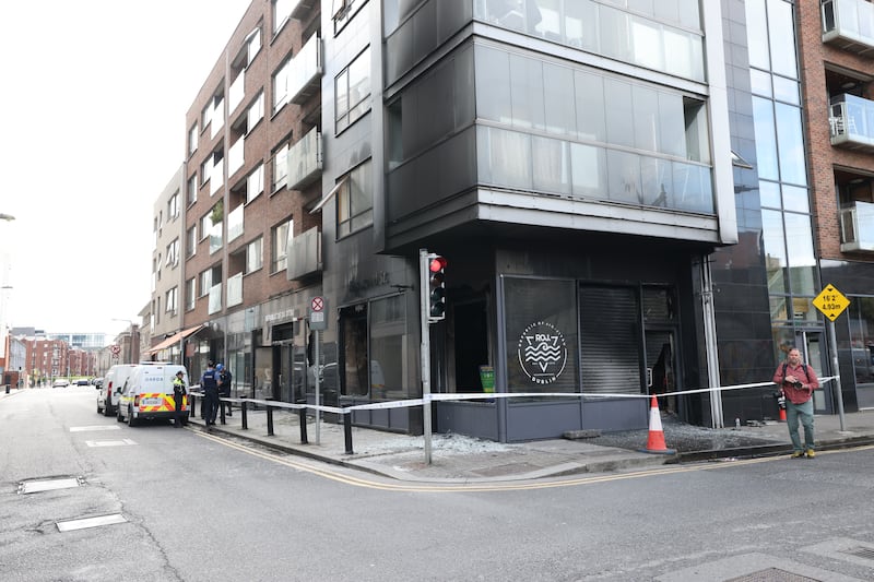 The fire damaged premises, above which apartments are located, was cordoned off on Tuesday morning. Photograph: Bryan O'Brien