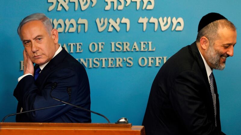 Israeli prime minister Binyamin Netanyahu and interior minister Arye Deri:   deal with UN refugee agency cancelled shortly after it was announced. Photograph: Menahem Kahana/AFP/Getty Images