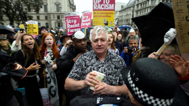 A supporter of US president Donald Trump had a milkshake thrown over him by anti-Trump protesters in London. Photograph: Clodagh Kilcoyne/Reuters
