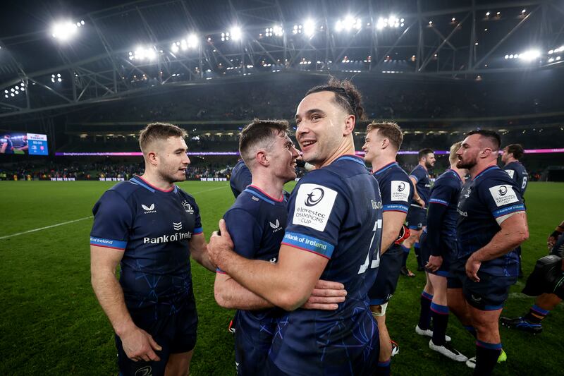 Leinster's Luke McGrath celebrates after the game with Jordan Larmour and James Lowe. Photograph: Ben Brady/Inpho
