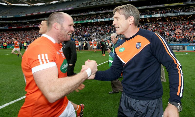 Ciarán McKeever with Armagh manager Kieran McGeeney. Photograph: Inpho