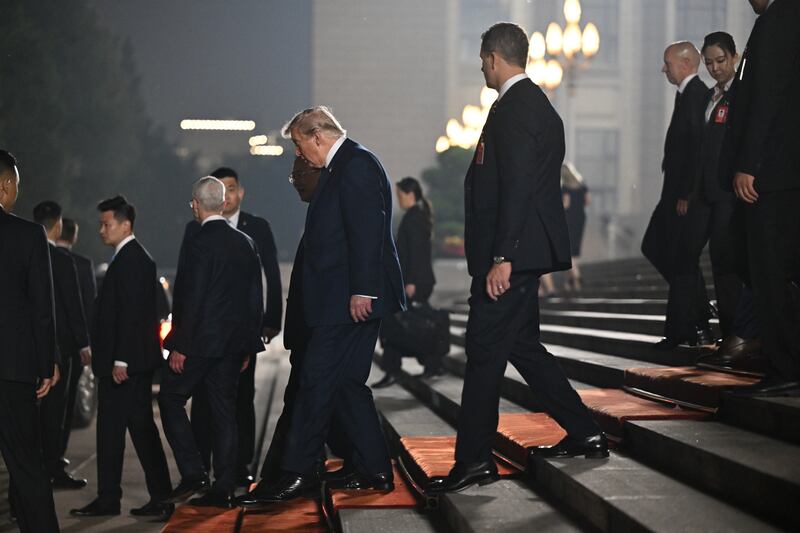 US president Donald Trump departs the Great Hall of the People in Beijing after a state banquet with president Xi Jinping of China. Photograph: Kenny Holston/The New York Times