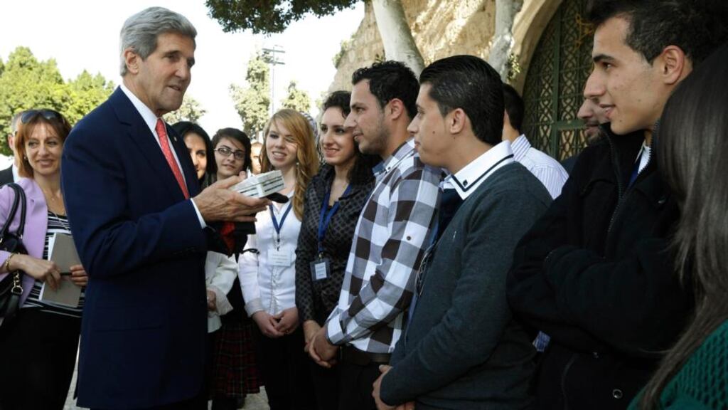 US secretary of state John Kerry meets young Palestinians who presented him with a gift box at Manger Square in Bethlehem yesterday. Photograph: Jason Reed/Reuters