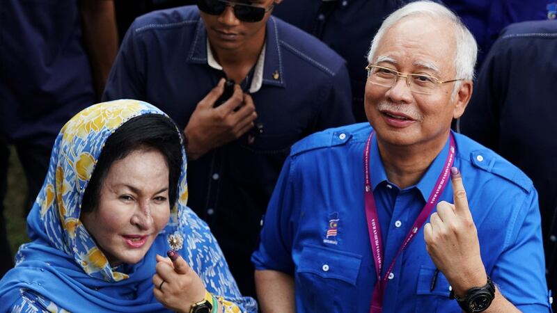 Malaysian prime minister Najib Razak of Barisan Nasional (National Front) and his wife Rosmah Mansor show their ink-stained fingers after voting in Pekan, Pahang. Photograph:   Athit Perawongmetha/Reuters