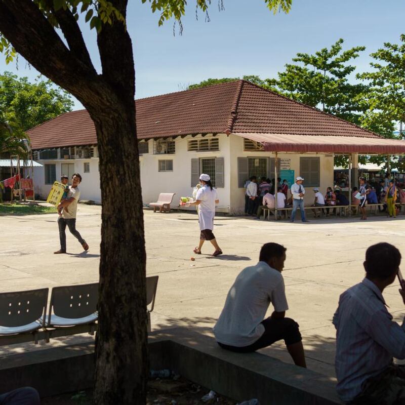 Sreng carries a blood sample to the laboratory. Photograph: Thomas Cristofoletti/New York Times