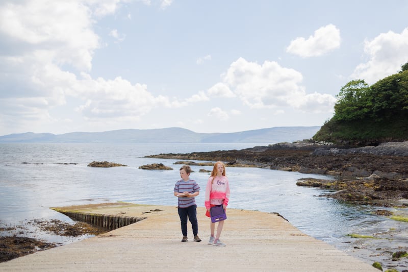 The children from 3rd to 6th class go on a beach walk to compile a nature report of their findings on their iPads on Bere Island, Co Cork. Photograph: Dan Dennison