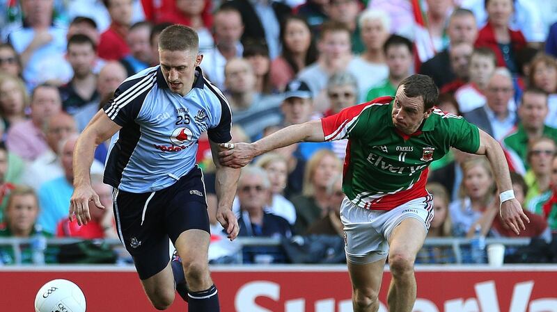 Dublin’s Eoghan O’Gara takes on Mayo’s  Keith Higgins in the 2013 All-Ireland final. Photograph: Lorraine O’Sullivan/Inpho
