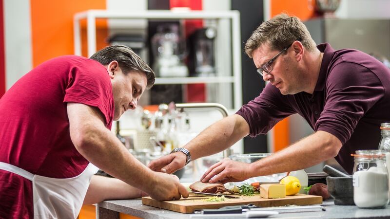 Chef Daniel Clifford (right) lending a helping hand to celebrity MasterChef contestant, actor Simon Delaney