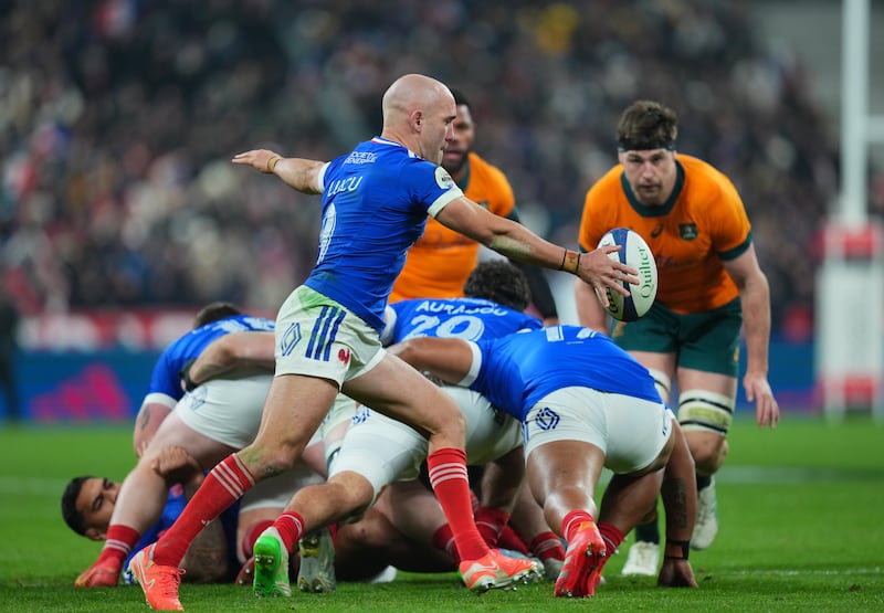 France's Maxime Lucu kicks the ball from behind a ruck. Photograph: Franco Arland/Getty Images