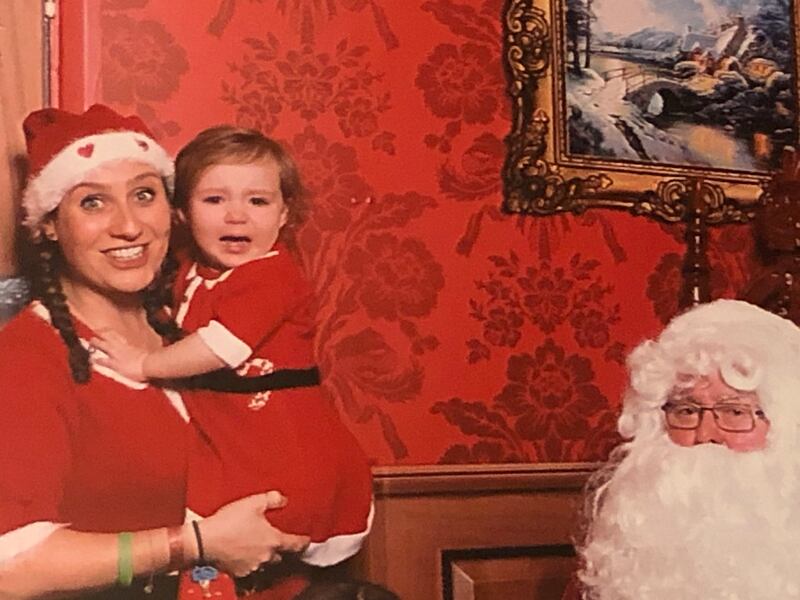 Conor Pope’s wife, Sonia, with their daughter Ruby, meeting Santa for the first time at Center Parcs
