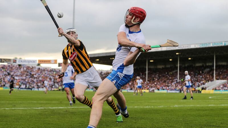 Tadhg de Burca  under pressure from Kilkenny’s TJ Reid. Photograph: Cathal Noonan/Inpho