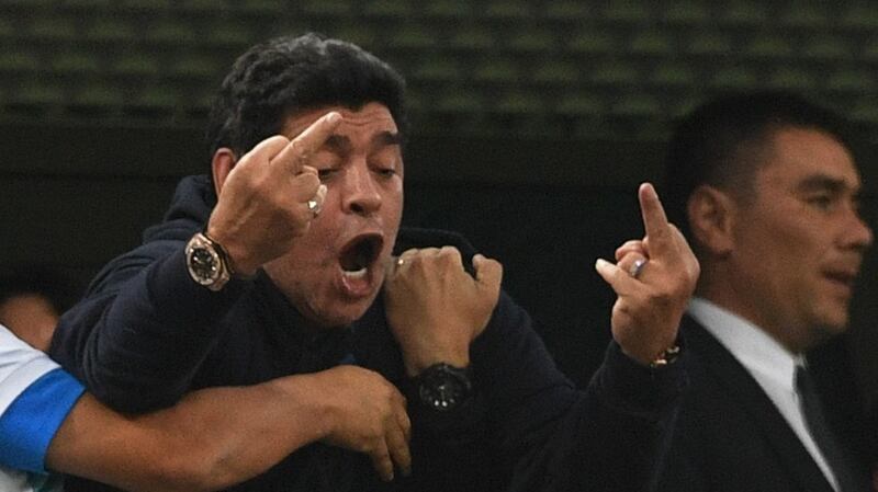 Retired Argentina player Diego Maradona gestures as he celebrates Argentina’s late winner against Nigeria. Photograph: Olga Maltseva/AFP/Getty