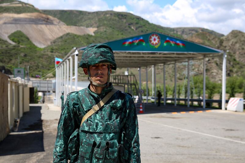 An Azerbaijani checkpoint at the entry of the Lachin corridor. Azerbaijan  says the checkpoints and roadblocks are necessary to stop weapons being smuggled into Nagorno-Karabakh. Photograph: Tofik Babayev/AFP via Getty Images