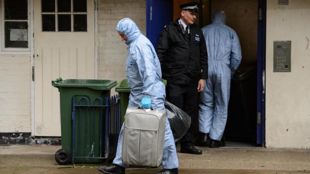 Police forensics officers remove evidence from a flat at Macey House, in Greenwich, southeast London, yesterday. Photograph: Dominic Lipinski/PA Wire