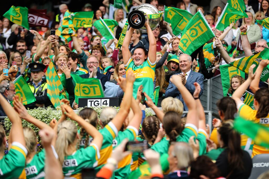 Michelle Guckian lifts the Mary Quinn Memorial Cup following Leitrim's victory in the All-Ireland intermediate final at Croke Park. Photograph: Ben Brady/Inpho