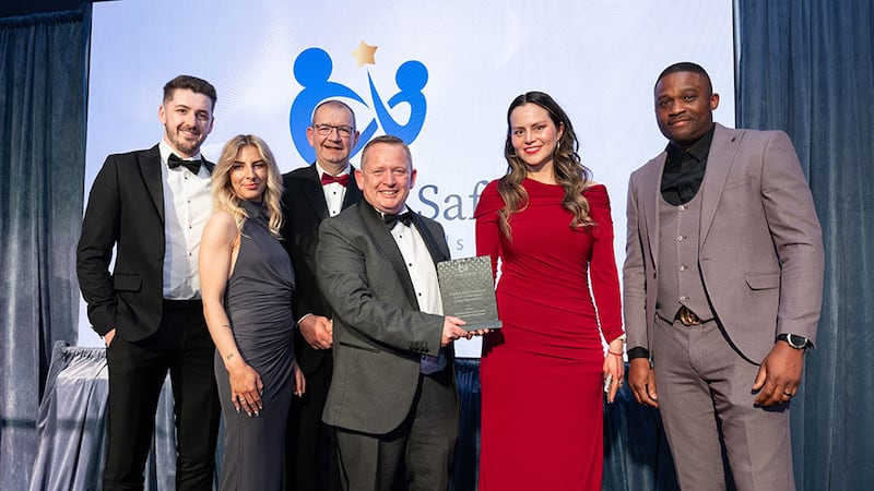Ben Byrne, managing director of Ashview Consultants, presents the health & safety excellence award - construction (large organisation) to Conack team