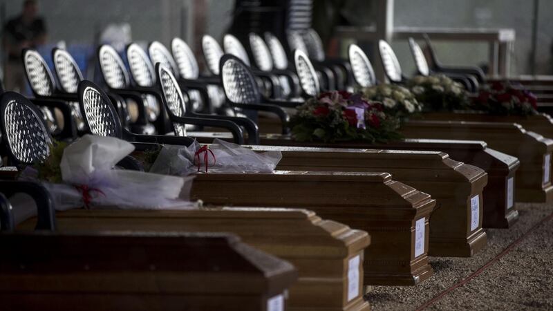Some of the coffins in a tent for the funeral of victims in Amatrice. The devastating  August 24th earthquake in central Italy has left so far a total of 292 dead. Photograph: Massimo Percossi/EPA