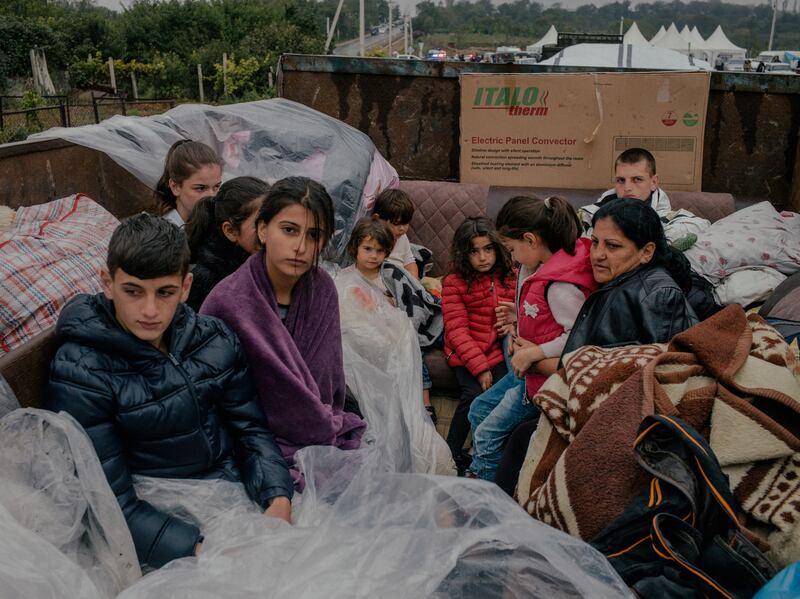 Refugees in the border village of Kornidzor, Armenia, after fleeing the conflict in Nagorno-Karabakh. Photograph: Nanna Heitmann/New York Times
                      