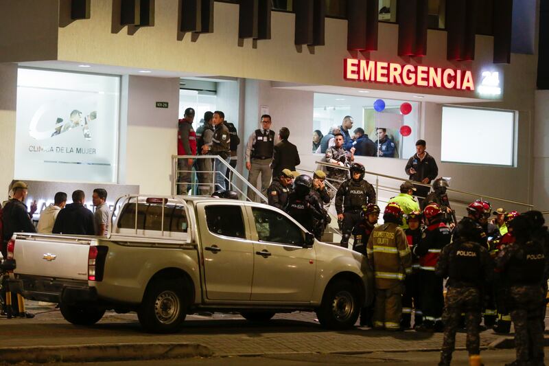 A bullet-riddled vehicle is surrounded by police as they guard the hospital where several of the injured were taken after the attack. Photograph: Juan Diego Montenegro/AP