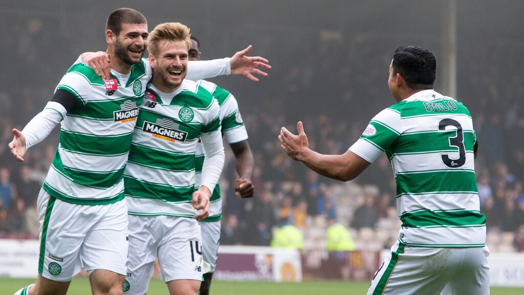 Celtic’s Nadir Ciftci celebrates scoring his teams first goal of the game with teammate Emilio Izaguirre. Photograph: Jeff Holmes/PA