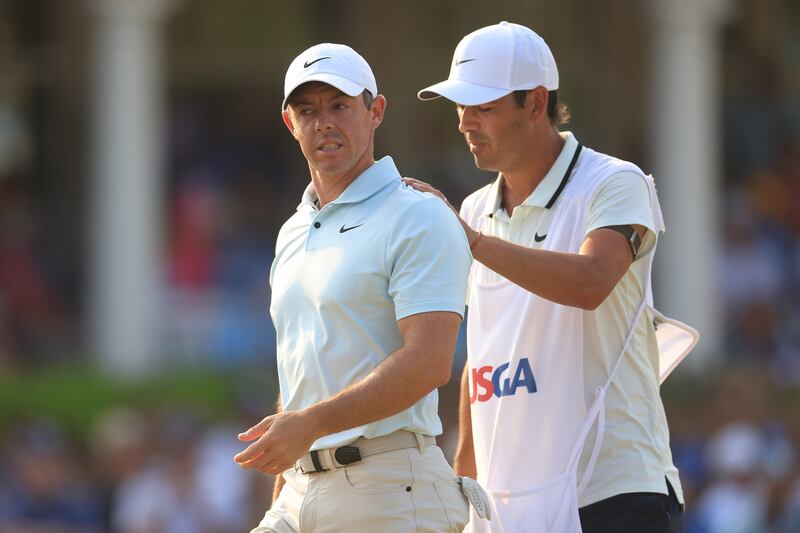 Rory McIlroy is consoled by his caddie Harry Diamond after making a bogey on the 18th hole during the final round. Photograph: Sean M. Haffey/Getty Images