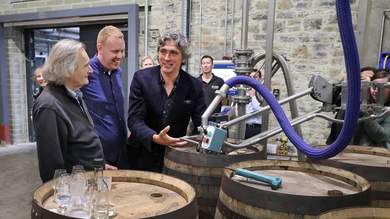 The first barrel containing malt whiskey made with barley harvested on the Slane Castle estate being filled  at Slane Distillery last month. Slane Irish Whiskey co-founders Lord Henry Mount Charles (left) and Alex Conyngham (centre) with Alan Buckley, assistant distillery manager. Photograph: Marc O’Sullivan