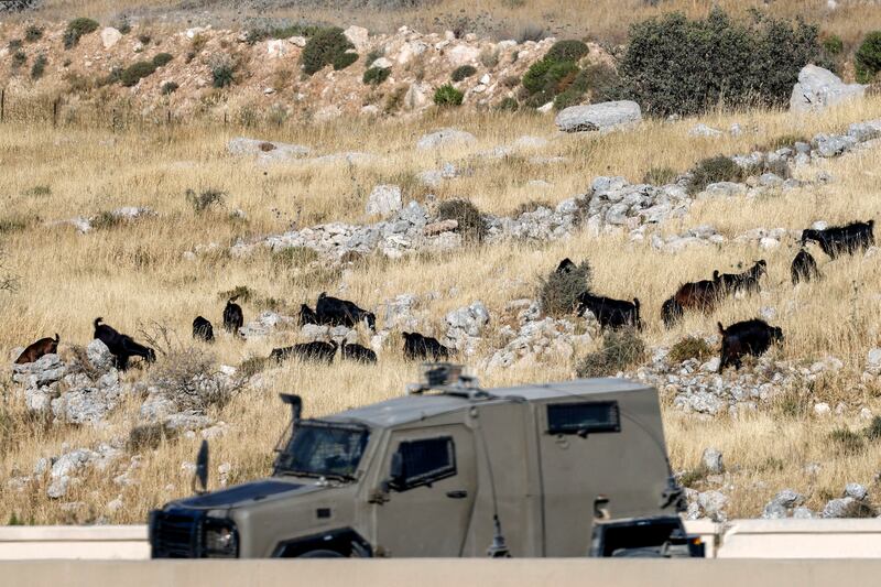 An Israeli military vehicle moves past sheep belonging to Israeli settlers east of the Palestinian village of Beitin, northeast of Ramallah in the occupied West Bank, on June 14th. Photograph: Zain Jaafar/AFP via Getty