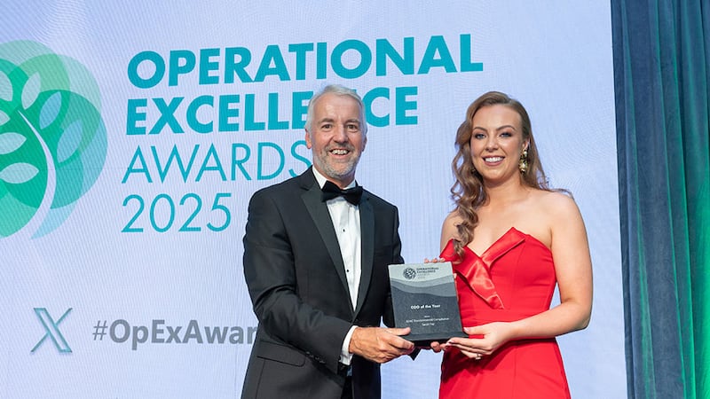 Brian Coll, awards judge (judging coordinator), presents the operations manager/COO of the year award to Sarah Fay, EDAC Environmental Compliance