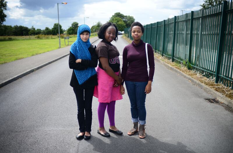 Natasha Maimba (12) (centre) pictured with friends Minahil (12) and Yolanda (17) who lived at the time in 2014 in Athlone Direct Provision Centre at Lissywollen, just outside the town. Photograph: Bryan O'Brien / THE IRISH TIMES
