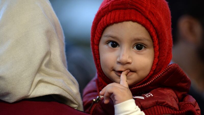 Samir Youzbashi Aljafari and his wife Wafaa’s grandson Yousef: the couple  met the one-year-old for the first time in Dublin Airport on Monday. Photograph:  Dara Mac Donaill