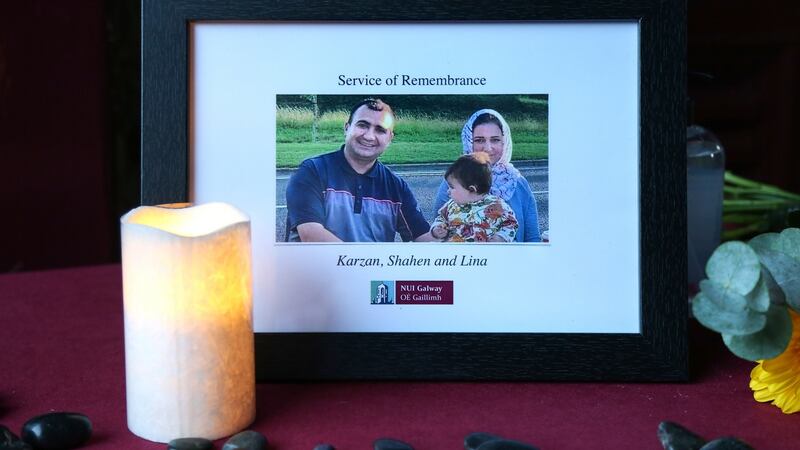Karzan, Shahen and baby Lina in a framed photo at the NUI Galway service. Photograph: Joe O’Shaughnessy