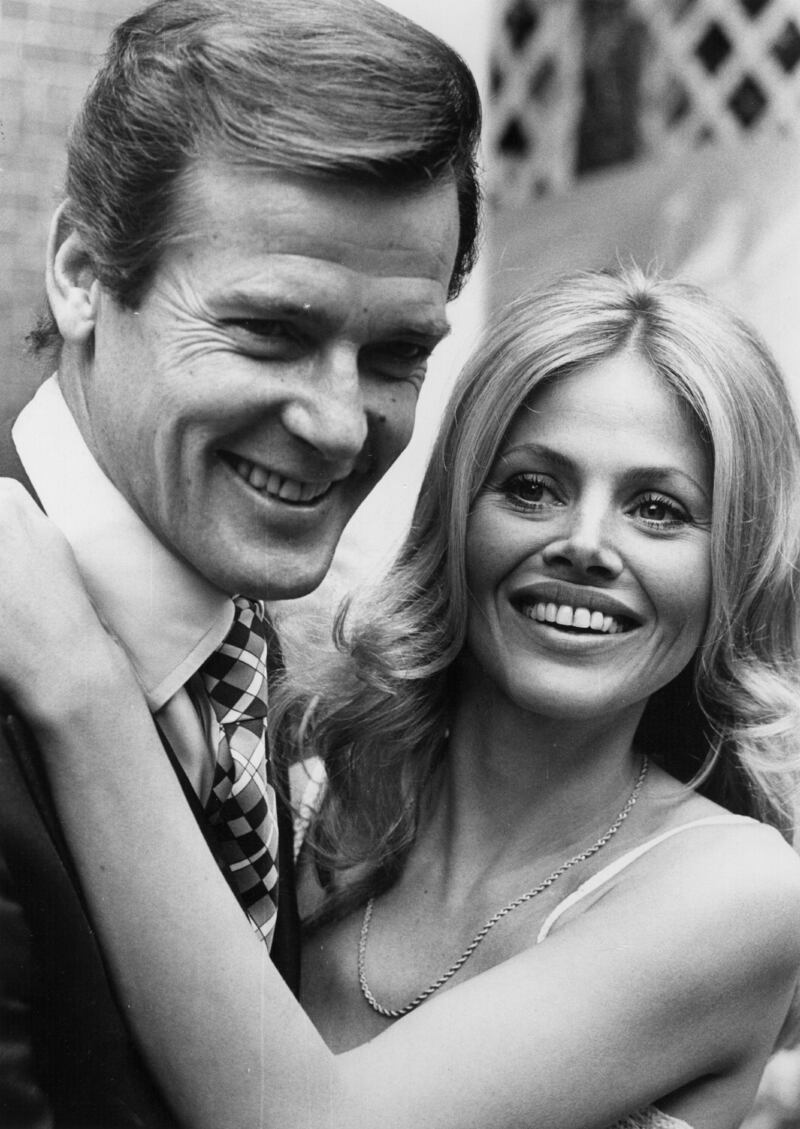 Britt Ekland with Roger Moore, who she acted with in the James Bond film The Man with the Golden Gun, in 1974. File photograph: Central Press/Getty Images